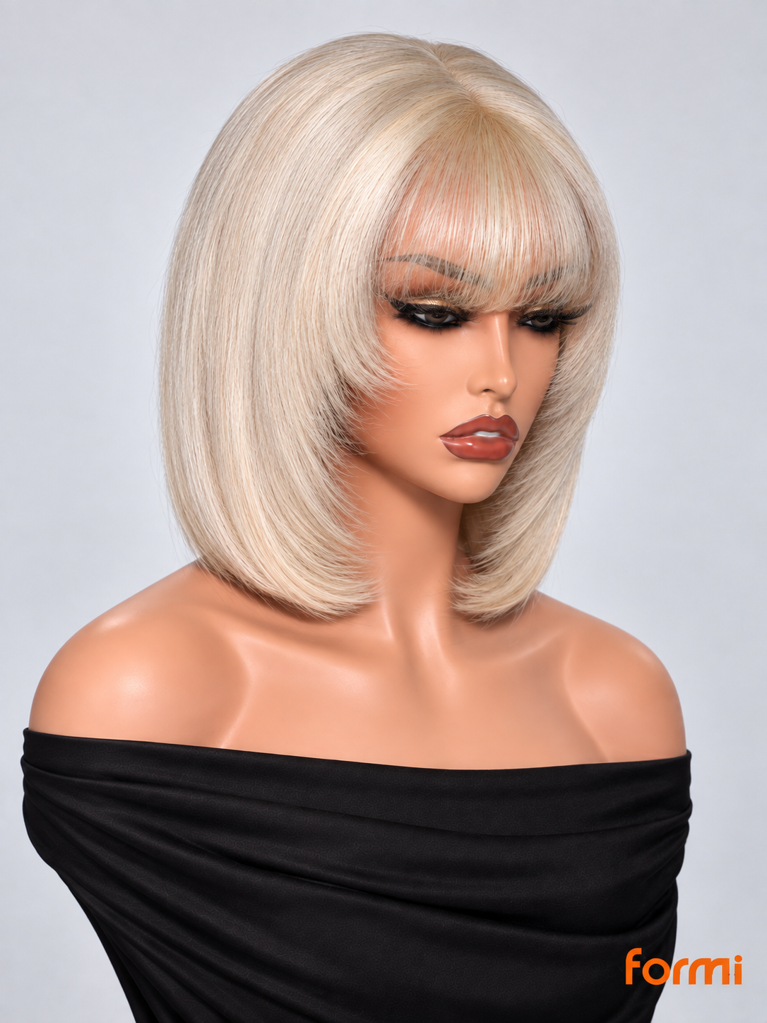 Angled view of #613 honey blonde glueless bob human hair wig with soft bangs