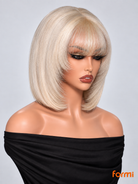 Angled view of #613 honey blonde glueless bob human hair wig with soft bangs