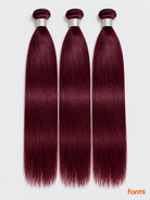 Three 99J burgundy straight human hair bundles with silver wraps on a pale gray background.